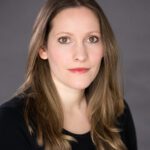 Head shot of Laura Bates. She has long brown hair