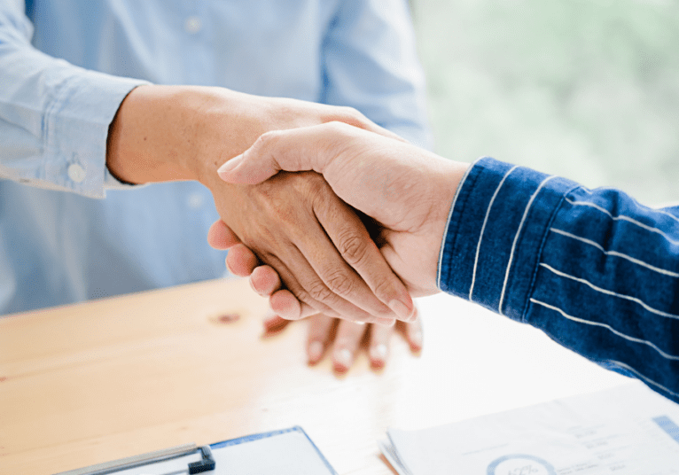 New corporate partnership pic - webpage (2) two people shaking hands