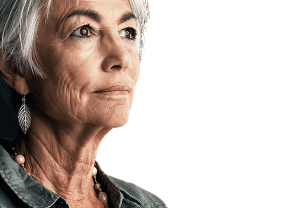 Older lady looking serious with short grey hair. Looking off into the distance