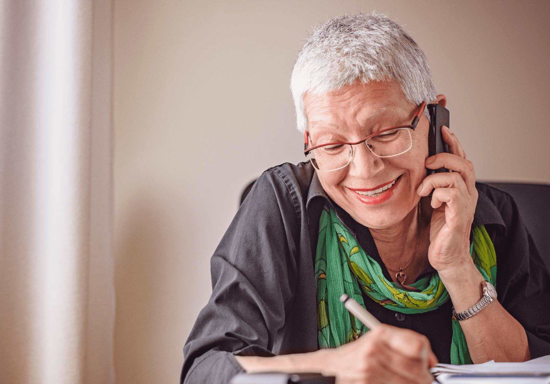 Untitled design (28) Older lady on the phone and writing with a pen