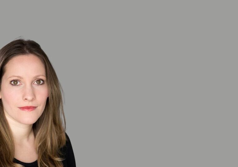 A head shot of Laura Bates. She has long brown hair.