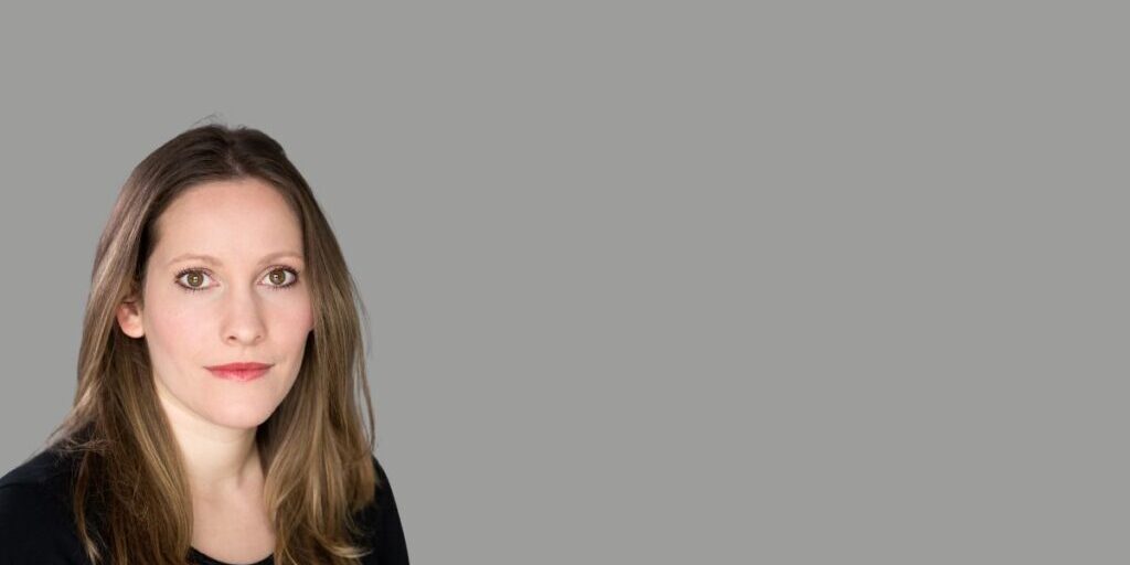 A head shot of Laura Bates. She has long brown hair.